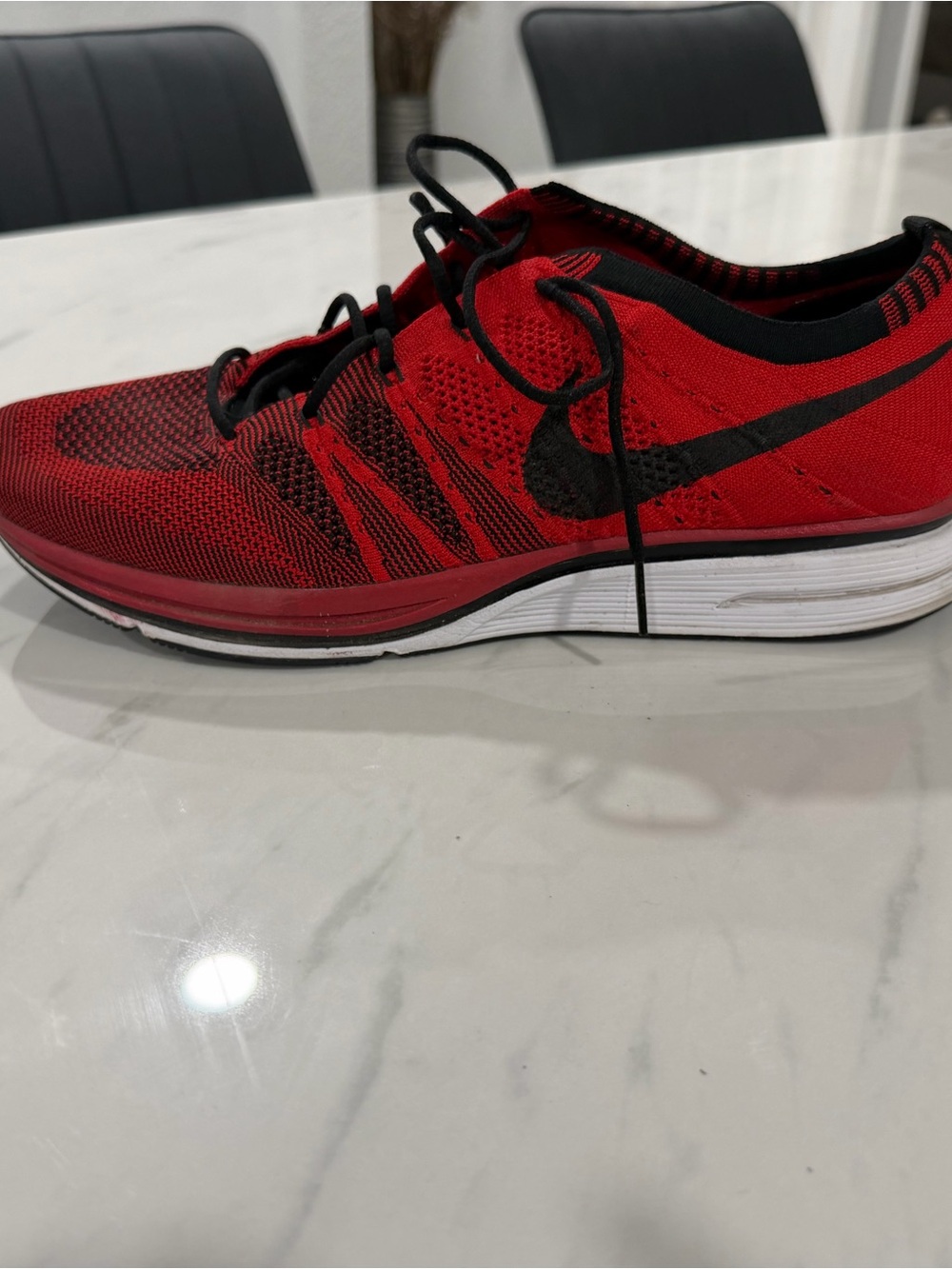 Nike Men’s Red and Black Flyknit Athletic Shoes